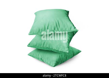 Stack of green pillows isolated on white background. Pile of  decorative cushions for sleeping and resting, home interior, house decor. Stock Photo