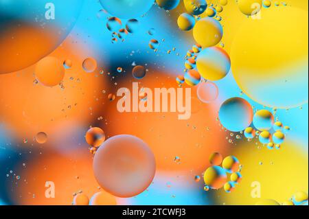 blue and orange spots with multi-colored circles similar to the galaxy and microcosm Stock Photo