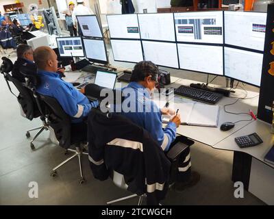 Petroperu personnel monitoring the systems in the control room of the New Talara Refinery facilities, operated by Petroperu, with the capacity to process up to 95,000 oil barrels per day and which has been built at a cost of more than 5,000 million dollars. Stock Photo