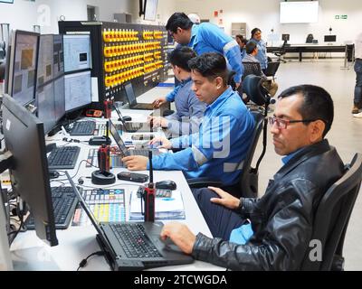 Petroperu personnel monitoring the systems in the control room of the New Talara Refinery facilities, operated by Petroperu, with the capacity to process up to 95,000 oil barrels per day and which has been built at a cost of more than 5,000 million dollars. Stock Photo