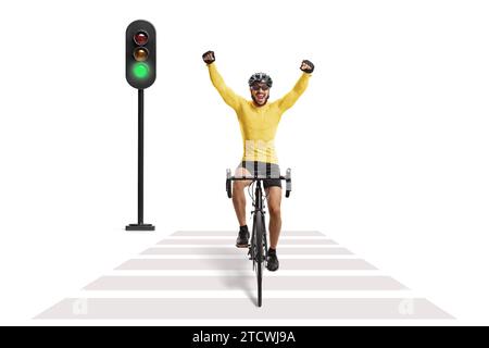 Male cyclist riding a road bicycle at a pedestrian crossing isolated on white background Stock Photo