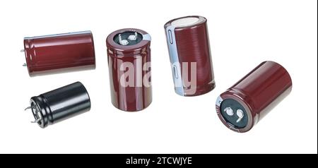 Set of various electrolytic capacitors isolated on a white background. Close-up a group of passive two terminal electronic components to store energy. Stock Photo