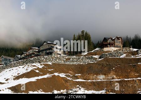 New houses and cleared undeveloped lots in new subdivision on lower slope of Rainbow Mountain, Whistler Blackcomb, BC, Canada. Stock Photo