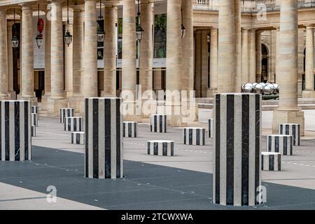 The inner courtyard, Cour d'Honneur, at The Palais Royal with an art installation by Daniel Buren of  black and white striped columns, Paris, France Stock Photo