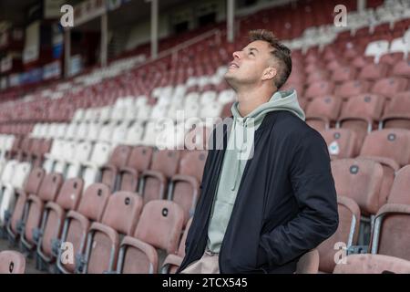 Cottbus, Germany. 14th Dec, 2023. Singer Alexander Knappe stands on an empty stand in the 'Stadium of Friendship'. Credit: Frank Hammerschmidt/dpa/Alamy Live News Stock Photo