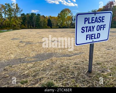 Construction photo of a please stay off field sign on a sports field or pitch Stock Photo