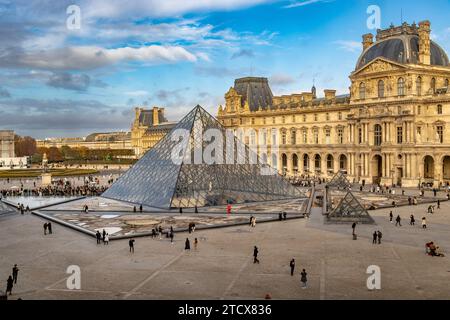 The Louvre Pyramid is a large glass-and-metal structure The pyramid  and serves as the main entrance to the Louvre Museum in Paris, France Stock Photo