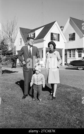 U.S. Senator and Democratic nominee for U.S. President John F. Kennedy with his wife Jacqueline Kennedy and daughter Caroline, standing outside their house, Irving Street, Hyannis Port, Massachusetts on election day, Marion S. Trikosko, U.S. News & World Report Magazine Photograph Collection, November 8, 1960 Stock Photo