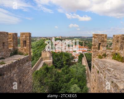 Panoramic view of Obidos city. Hilltop town Óbidos remains, well-preserved example of medieval architecture. Streets, squares and fortified castle. Stock Photo