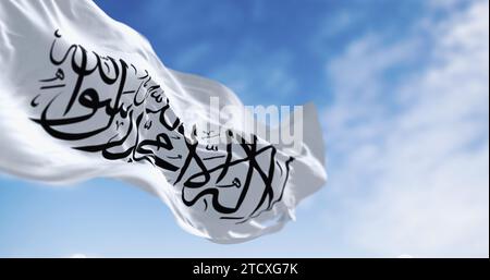 Islamic Emirate of Afghanistan flag waving in the wind. Unrecognized Islamic emirate that was established by taliban in August 2021 with the fall of K Stock Photo