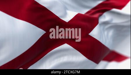 Close-up of Alabama state flag waving in the wind. Saint Andrew cross on a white background. 3D illustration render. Rippled textile. Selective focus Stock Photo