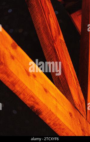 wooden beams illuminated by faint light at night Stock Photo