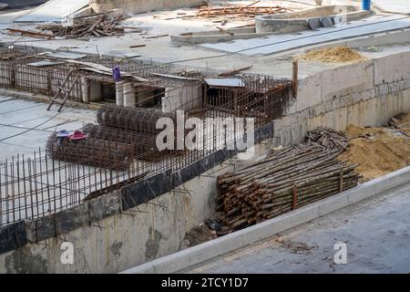 Construction site with foundation pit for monolithic reinforced skyscraper. Monolithic slab foundation and concrete pouring Stock Photo