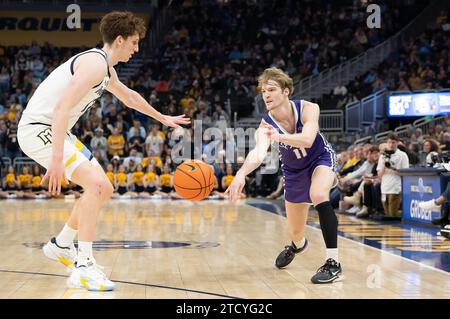 December 14, 2023: St. Thomas - Minnesota Tommies guard Drake Dobbs (11) passes the ball around Marquette Golden Eagles forward Ben Gold (12) during the NCAA basketball game between St. Thomas - Minnesota Tommies and the Marquette Golden Eagles at the Fiserv Forum in Milwaukee, WI. Kirsten Schmitt/Cal Sport Media. Stock Photo