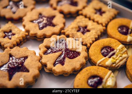 Classic various shapes of linzer Christmas cookies with strawberry jam Stock Photo