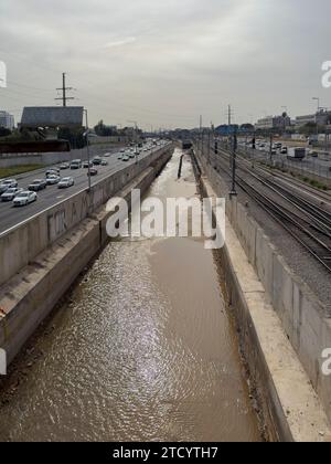 Overflow of the Ayalon river a perennial stream diverted from its original bed through an artificial concrete channel along the north-south Ayalon Freeway in Tel Aviv Israel Stock Photo