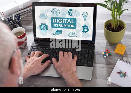 Digital disruption concept shown on a laptop used by a man Stock Photo