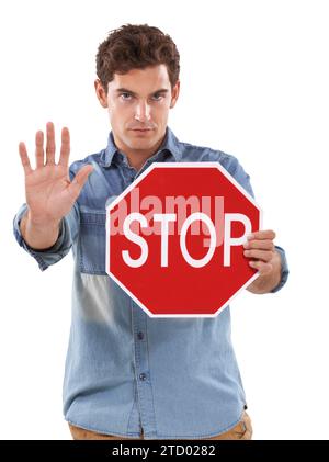 Portrait, man and traffic stop sign, palm and studio isolated on a white background. Person show red octagon symbol, hand and danger warning Stock Photo