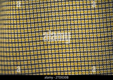 Close-up of a beautiful gold and black fabric. Stock Photo