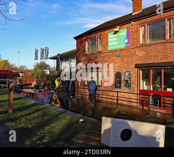 Santa cruises along the Chesterfield canal, the “John Varley II”, adorned with Father Christmas aboard rises up through Tapton lock in Chesterfield. Stock Photo