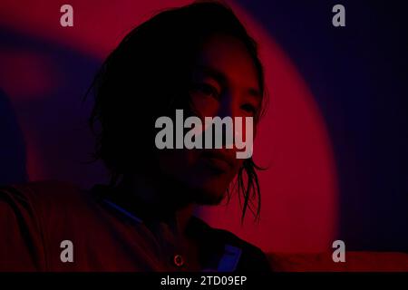 asian man in neon lighting Stock Photo
