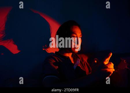 asian man in neon lighting Stock Photo