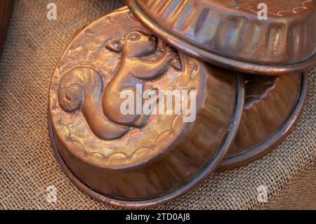 Italy, Lombardy, Flea Market, Old Copper Pudding Molds Decorated with a Squirrel Stock Photo