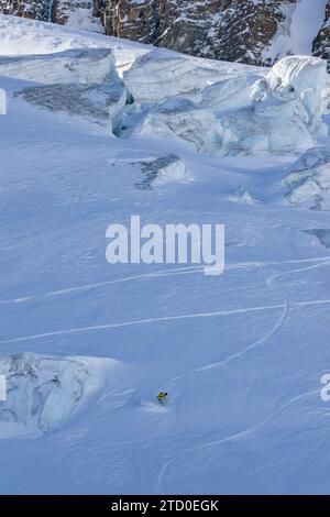 Aerial view of unrecognizable person snowboarding on snow covered mountain slope in Zermatt, Switzerland Stock Photo