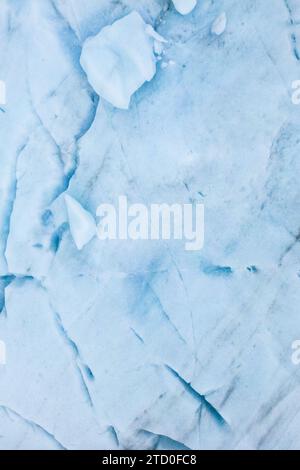 A high-resolution image showcasing a textured ice background with subtle blue hues and intricate patterns created by nature. Stock Photo