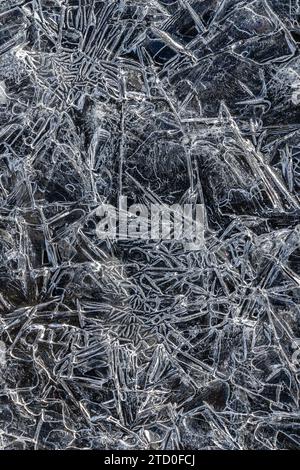 This image captures the beauty of frosty textures with close-up details of intricate ice patterns, ideal for a natural, wintry background. Stock Photo