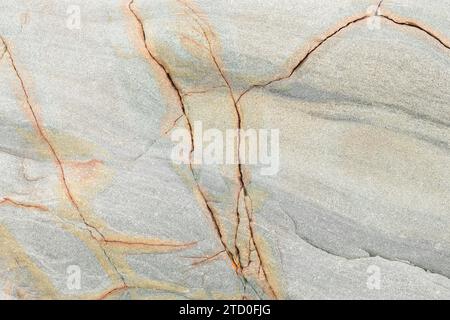 Highly detailed marble surface with unique veins and earthy tones, suitable as a luxurious background Stock Photo