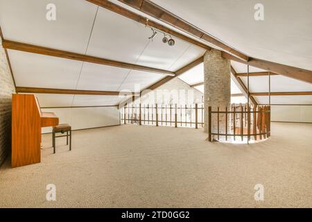 View of Open plan studio apartment with piano, cool carpet and triangle shaped ...