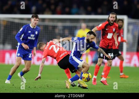 Manolis Siopis of Cardiff City (r) breaks away from Jay Stansfield  of Birmingham City (28). EFL Skybet championship match, Cardiff city v Birmingham City at the Cardiff City Stadium in Cardiff ,Wales on Wednesday 13th December 2023. this image may only be used for Editorial purposes. Editorial use only, pic by  Andrew Orchard/Andrew Orchard sports photography/Alamy Live news Stock Photo