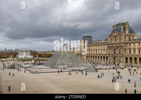 The Louvre Pyramid is a large glass-and-metal structure The pyramid  and serves as the main entrance to the Louvre Museum in Paris, France Stock Photo