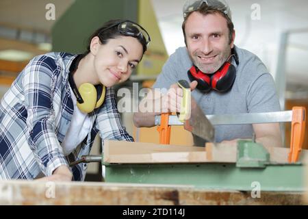 couple of carpenters in the workshop Stock Photo