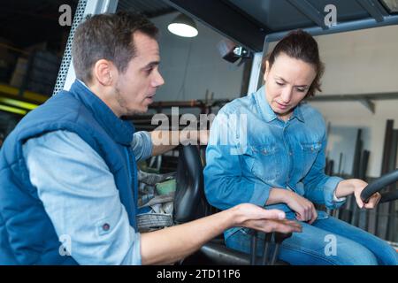 forklift driver and supervisor with at warehouse Stock Photo