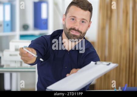 young man showing his pen Stock Photo
