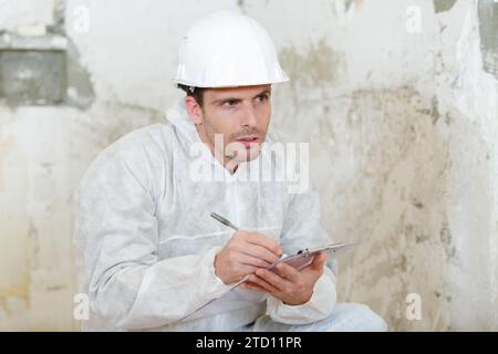 builder thinking about something indoors Stock Photo