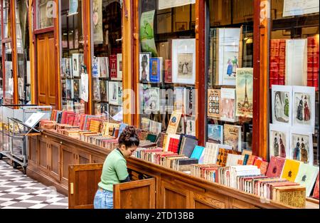 Librairie du Passage a vintage and rare bookshop located inside Passage Jouffroy, one of the most popular covered passageways in Paris, France Stock Photo