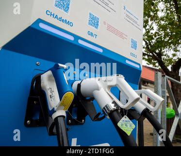 Sochi, Russia - February 13, 2023: Guns for charging cars of different standards Stock Photo