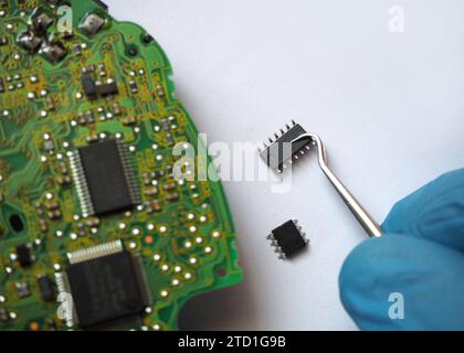 Supply of electronic component spare parts in the semiconductor industry. Surface-mount technology. Focused on the 14-legged smt integrated circuit. Stock Photo