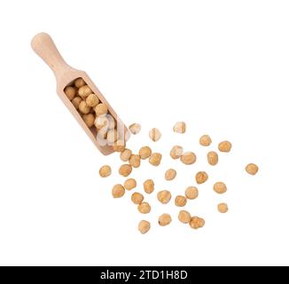 pile of shelled hazelnut kernels in wooden scoop isolated on white background with clipping path, top view, concept of healthy breakfast, vegan food Stock Photo