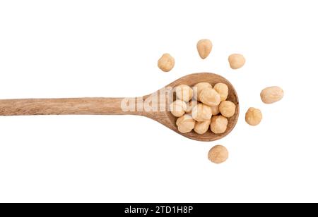 heap of hazelnuts in spoon isolated on white background with clipping path, top view, concept of healthy breakfast, vegan food Stock Photo