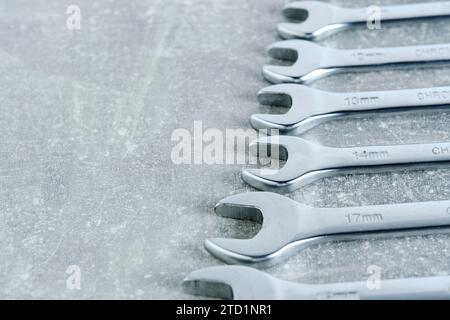 Set of wrenches gray concrete background Stock Photo