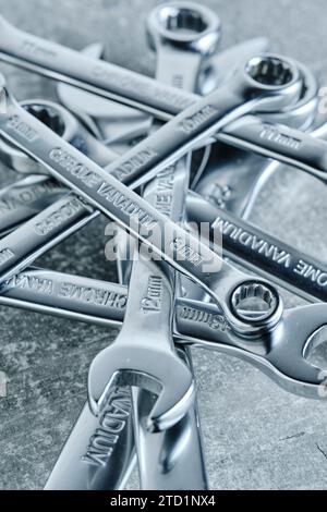 Set of wrenches gray concrete background Stock Photo