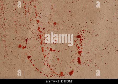 Blood splatters on brown paper background Stock Photo