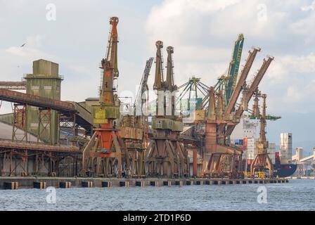 Santos city, Brazil. Old cranes at the grain export terminal at the port of Santos. Stock Photo