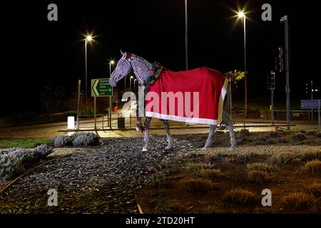 Horse sclupture in Horsforth,Leeds,has been given a makeover for  Christmas. The horse can now be seen wearing a coat,hat & garland with lights Stock Photo