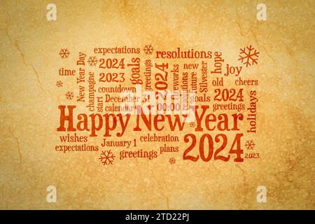 Happy New Year 2024 greetings card  - word cloud on a retro handmade paper Stock Photo