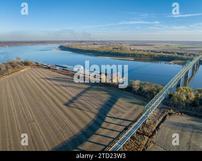 barges on the Ohio River at confluence with the Mississippi below Cairo, IL, November aerial view Stock Photo